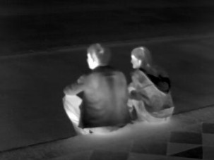 thermal photo of young couple sitting (greyscale)
