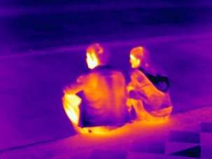 thermal photo of young couple sitting (iron)