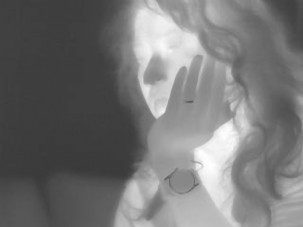thermal photo of a pensive woman